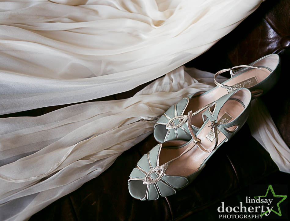 closeup wedding dress and blue shoes at hotel Palomar in Philadelphia