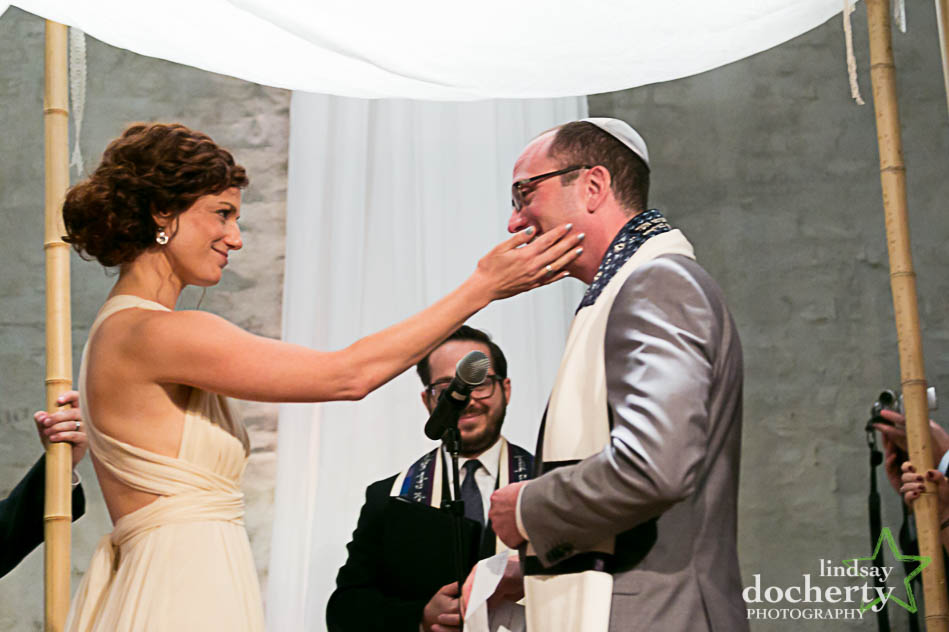 sweet moment in wedding ceremony at Front and Palmer in Philadelphia